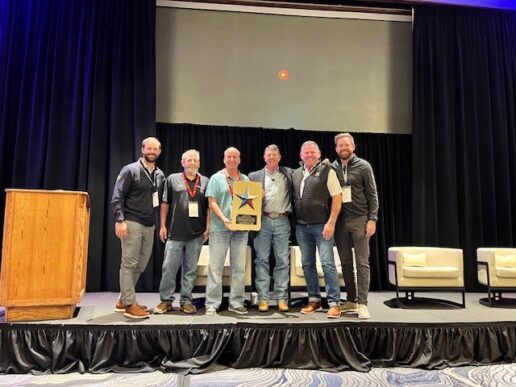 A photo of American RV Center representatives accepting the Route 66 RV Network's 2025 Larry Coker Commitment Award.