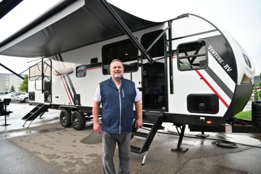 A photo of Venture RV's Dave Boggs outside the Venture Stratus travel trailer.