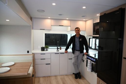 A photo of Grant Smith inside the Winnebago Thrive travel trailer.