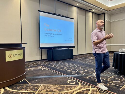 A photo of former college basketball official and Lippert leadership development director, Dustin Kaehr, speaking on constructive communication at the 2025 RVDA Convention.