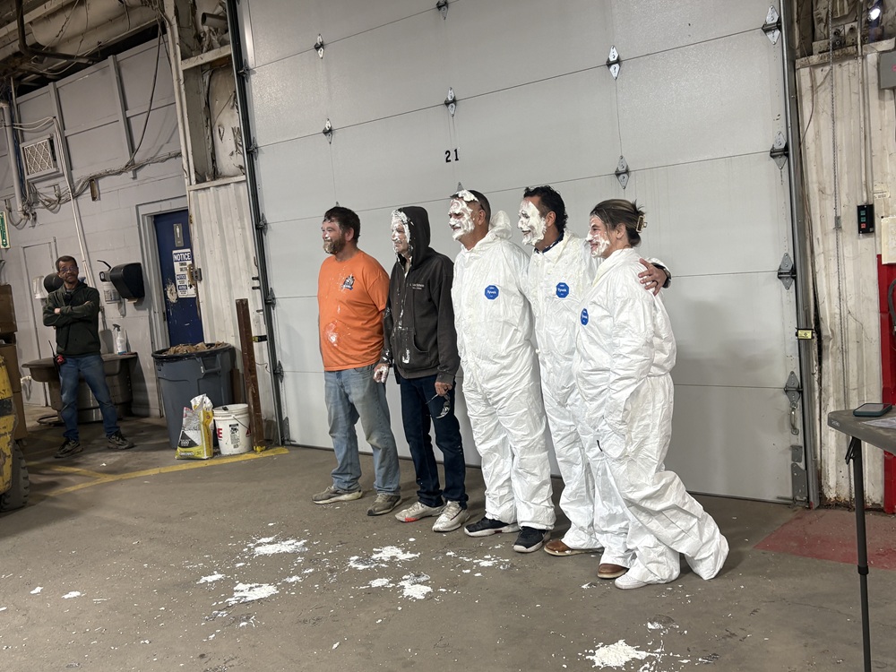 Members of Coachmen RV's Plant 210 are pictured after taking a pie to the face.