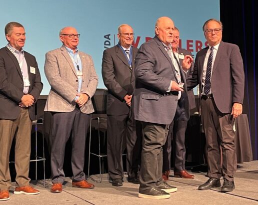 A photo of Ron Shepherd receiving his award from Phil Ingrassia.