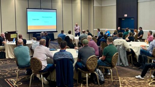 A photo of former college basketball official and Lippert leadership development director, Dustin Kaehr, speaking on constructive communication at the 2025 RVDA Convention.