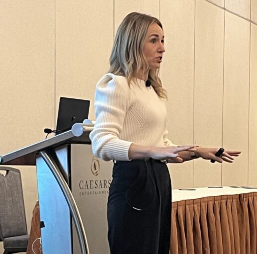 A photo of Bob Clements International President Sara Hey giving a presentation at the 2025 RVDA Convention.