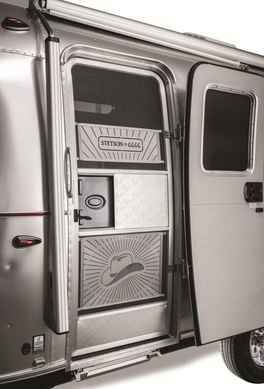 A picture of the entry screen door on the Airstream Stetson + 6666 Special Edition travel trailer.