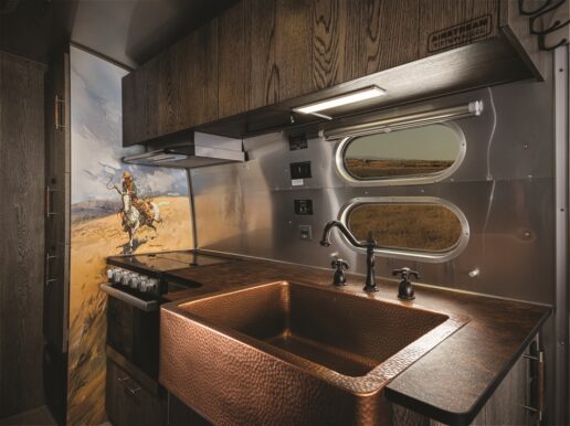 A picture of the kitchen of the Airstream Stetson + 6666 Special Edition travel trailer.