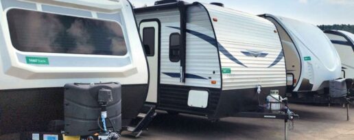 A photo of travel trailers in a parking lot.