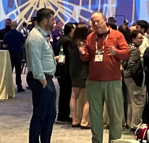 Ben Hirsch of Campers Inn RV (left) talks with NTP-Stag President Bill Rogers.