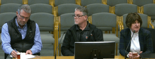 A photo of three RV dealers testifying at a Washington State Senate hearing on the length of fifth wheels.