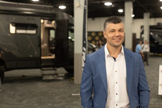 A picture of Leigh Tiffin on the exhibit floor at Tiffin Motorhomes' 2025 dealer meeting in Nashville, Tennessee.