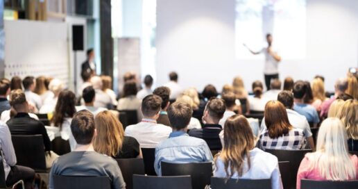 A stock photo of a person teaching a webinar, seminar or class.
