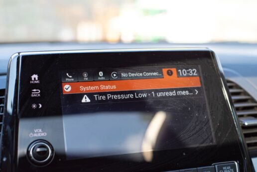 A stock photo of a low tire pressure warning on an RV's dashboard screen.